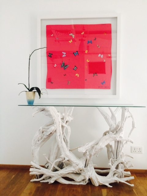 A driftwood foyer table in the Middle East